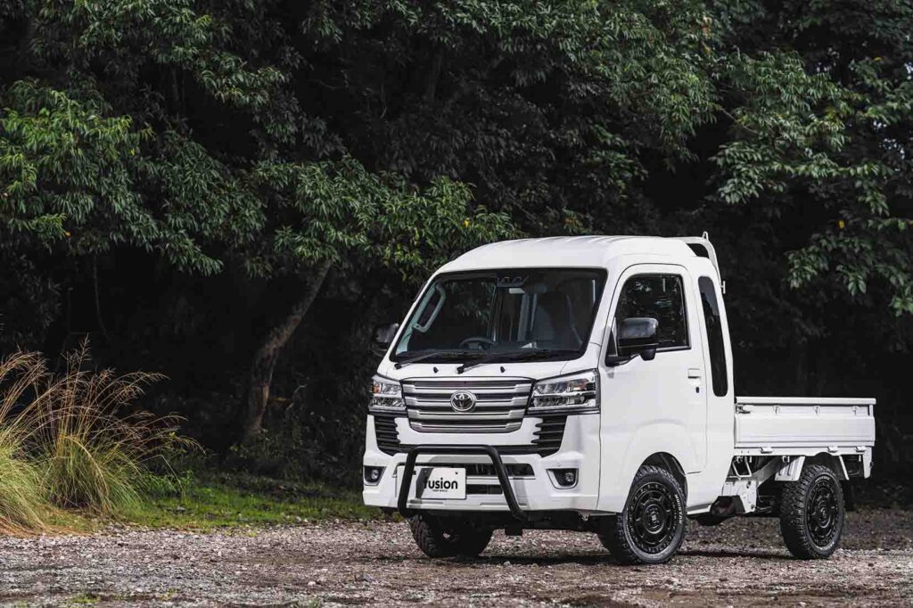 white kei truck on forest road compact mini truck japan