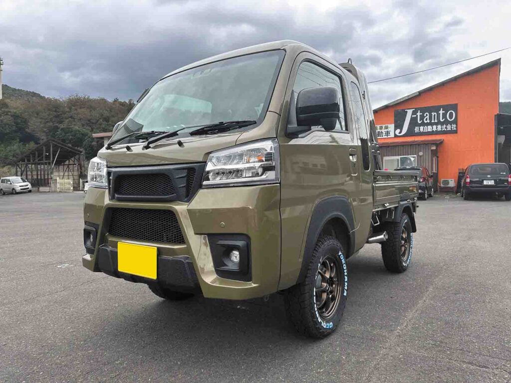 Olive green Hijet Truck custom build front view showing professional integration