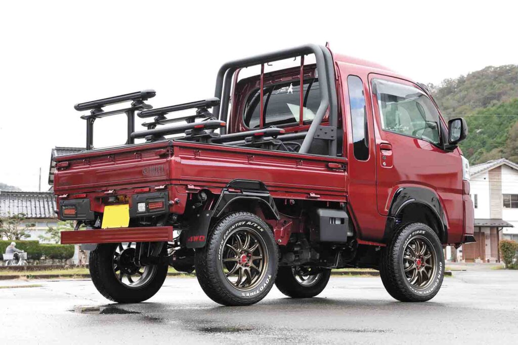 Red turbocharged Hijet Truck rear view showing lifted suspension and custom build